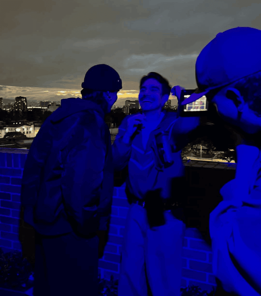 Gay men in Bogota Colombia socializing on a rooftop bar.